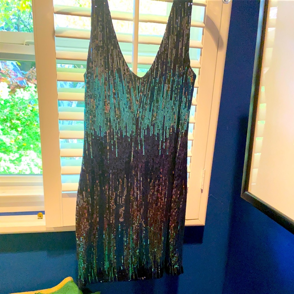 Shine in this sequined mini